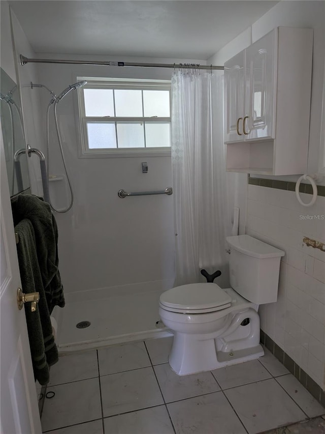 6536 Beach Blvd, Hudson, FL 34667 - bathroom featuring toilet, a shower with shower curtain, tile patterned floors, and tile walls