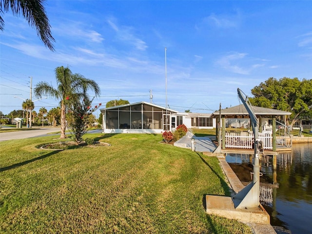 6536 Beach Blvd, Hudson, FL 34667 - view of green lawn featuring a sunroom and a water view