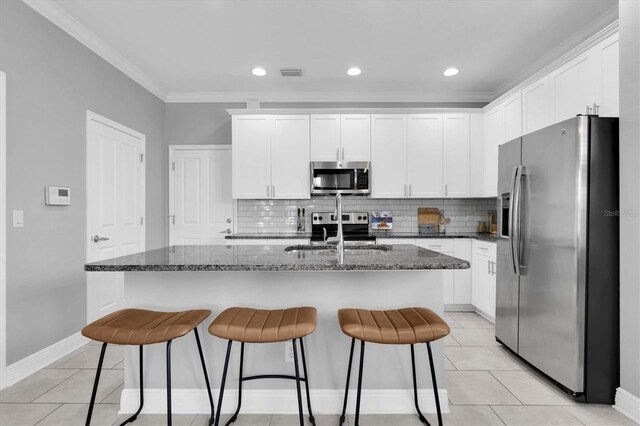 3465 Bumelia Ln, New Port Richey, FL 34655 - kitchen with light tile patterned flooring, a sink, white cabinetry, stainless steel appliances, and visible vents