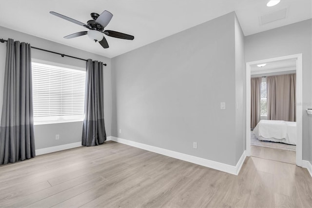 3465 Bumelia Ln, New Port Richey, FL 34655 - spare room featuring baseboards and light wood-style floors