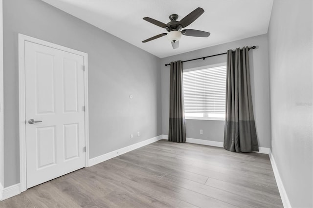 3465 Bumelia Ln, New Port Richey, FL 34655 - unfurnished room featuring a ceiling fan, baseboards, and wood finished floors