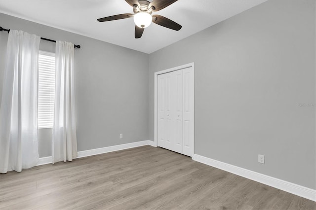 3465 Bumelia Ln, New Port Richey, FL 34655 - empty room with baseboards, ceiling fan, and light wood-type flooring