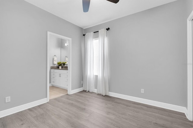 3465 Bumelia Ln, New Port Richey, FL 34655 - spare room featuring baseboards, light wood-type flooring, and ceiling fan