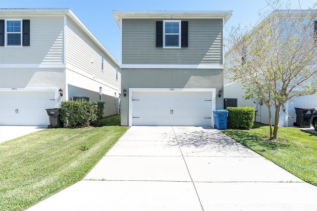 3465 Bumelia Ln, New Port Richey, FL 34655 - view of front of house with a front yard, concrete driveway, stucco siding, and an attached garage