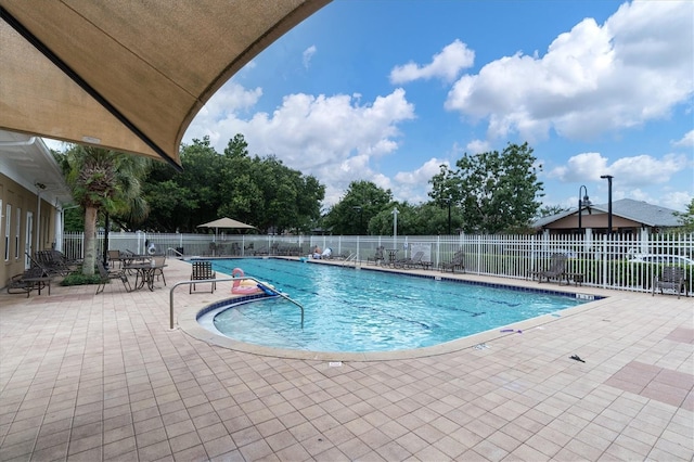 3465 Bumelia Ln, New Port Richey, FL 34655 - pool with fence and a patio area