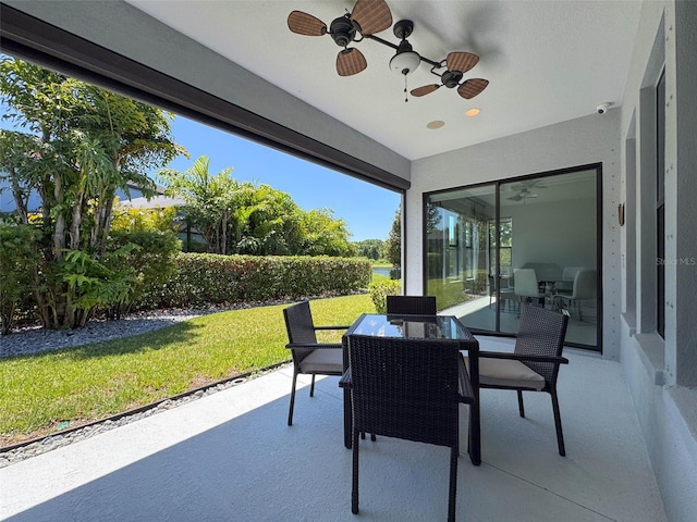 view of patio with ceiling fan and outdoor dining space