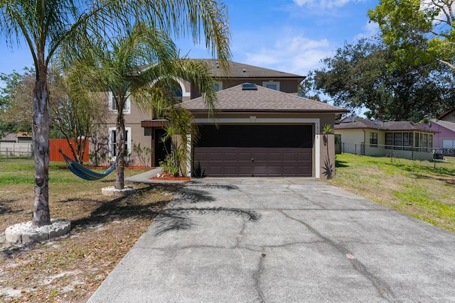view of front of house featuring stucco siding, fence, aphalt driveway, a front lawn, and a garage