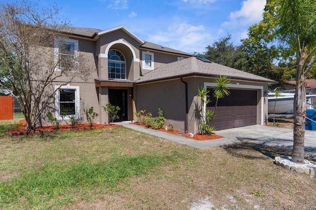 traditional home featuring driveway, a front yard, stucco siding, fence, and a garage