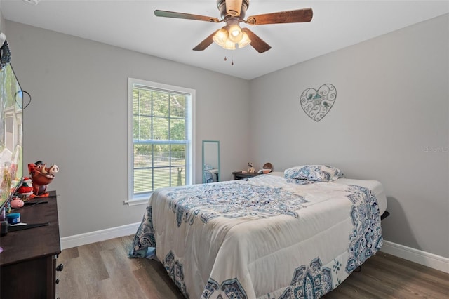 604 Kinnear Dr, Brooksville, FL 34601 - bedroom with wood finished floors, baseboards, and a ceiling fan