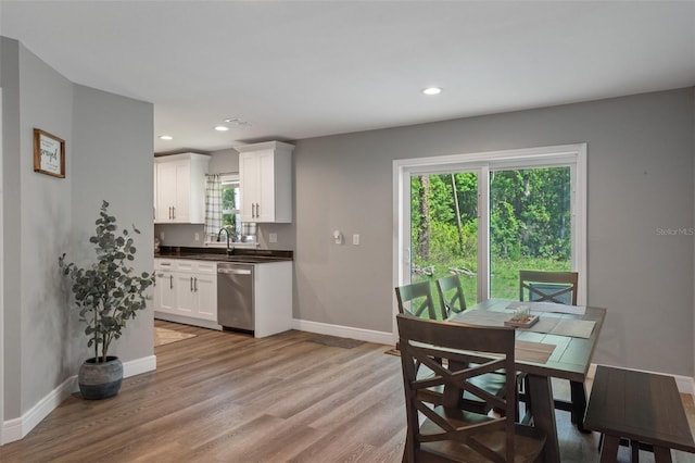 604 Kinnear Dr, Brooksville, FL 34601 - dining area with baseboards, light wood-style flooring, and recessed lighting