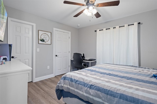 604 Kinnear Dr, Brooksville, FL 34601 - bedroom with wood finished floors, baseboards, and ceiling fan