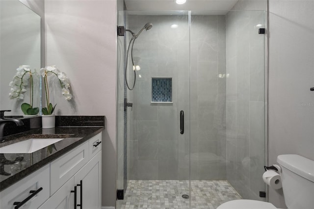 604 Kinnear Dr, Brooksville, FL 34601 - bathroom with toilet, a stall shower, and vanity