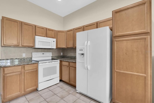 9348 Villa Entrada, New Port Richey, FL 34655 - kitchen featuring stone counters, light tile patterned floors, decorative backsplash, and white appliances