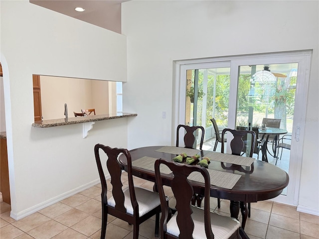 9348 Villa Entrada, New Port Richey, FL 34655 - dining room with recessed lighting, light tile patterned floors, a high ceiling, and baseboards