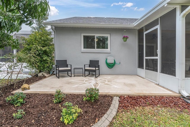 9348 Villa Entrada, New Port Richey, FL 34655 - view of patio with a sunroom