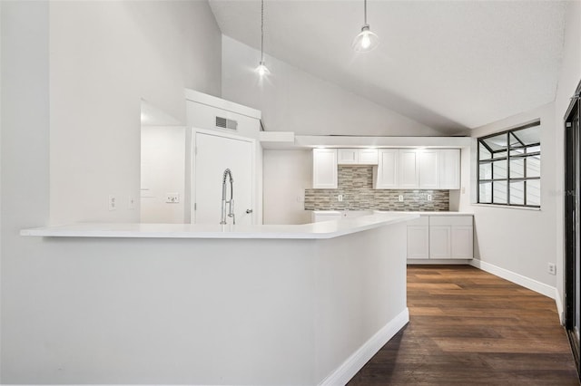 kitchen featuring white cabinets, tasteful backsplash, baseboards, visible vents, and dark wood-type flooring