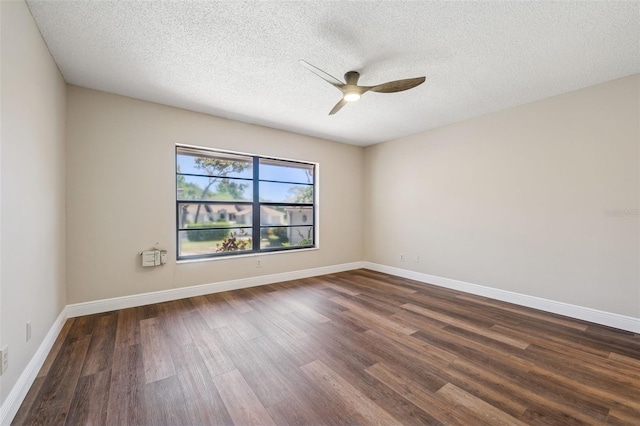 unfurnished room featuring baseboards, a ceiling fan, dark wood-style floors, and a textured ceiling