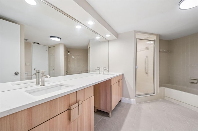 full bathroom featuring a shower stall, a sink, and recessed lighting