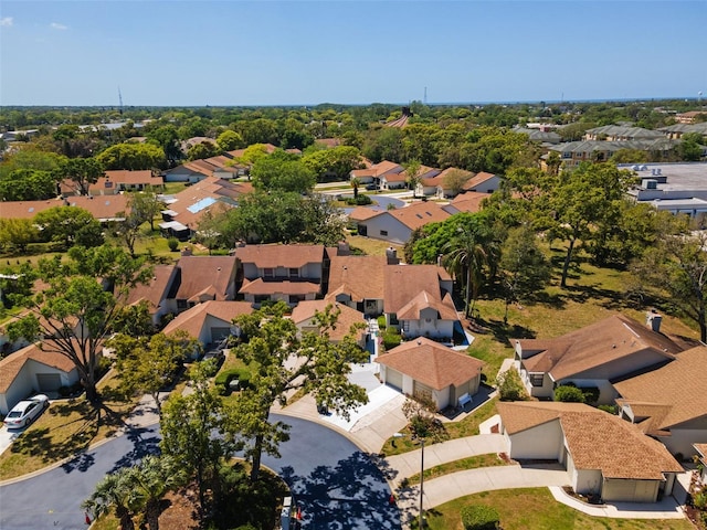 birds eye view of property with a residential view