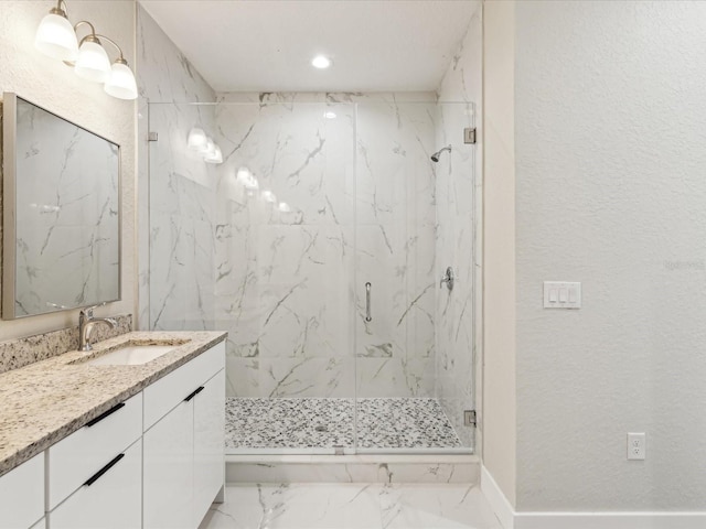 full bathroom with marble finish floor, a marble finish shower, recessed lighting, vanity, and a textured wall