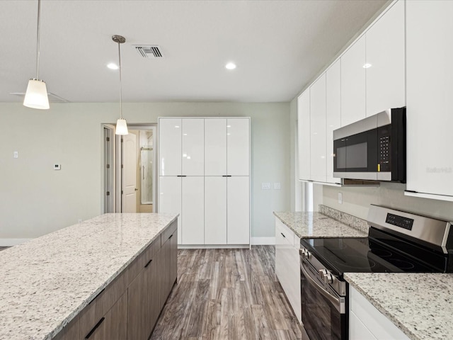 kitchen featuring white cabinetry, light wood-type flooring, visible vents, modern cabinets, and appliances with stainless steel finishes