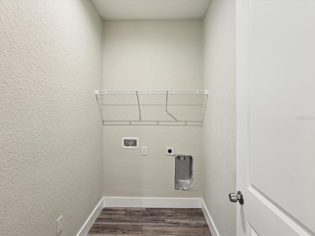 washroom featuring hookup for a washing machine, baseboards, laundry area, dark wood finished floors, and electric dryer hookup