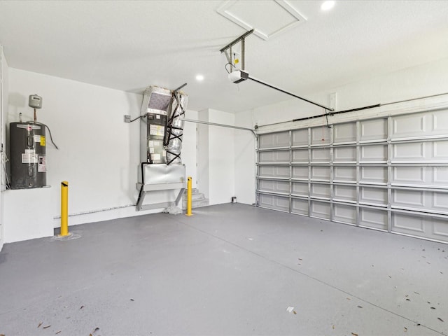 garage featuring heating unit, water heater, and a garage door opener