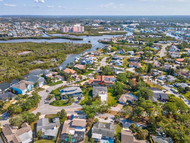 drone / aerial view with a residential view and a water view