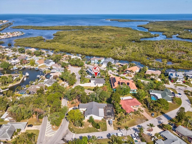 bird's eye view featuring a residential view and a water view