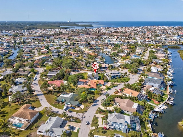 birds eye view of property featuring a residential view and a water view