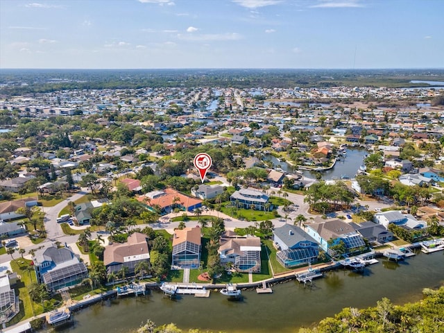 bird's eye view featuring a water view and a residential view