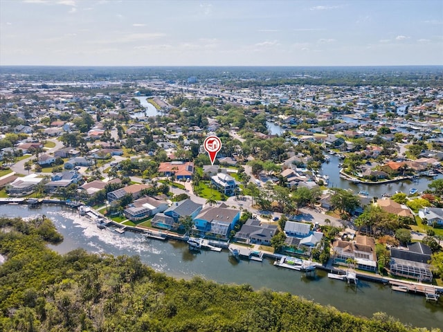 birds eye view of property featuring a residential view and a water view