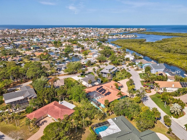 drone / aerial view featuring a residential view and a water view