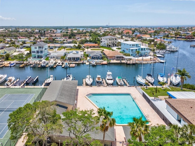 birds eye view of property featuring a residential view and a water view