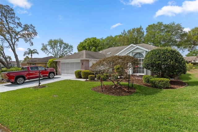 view of front facade with a garage, driveway, and a front yard