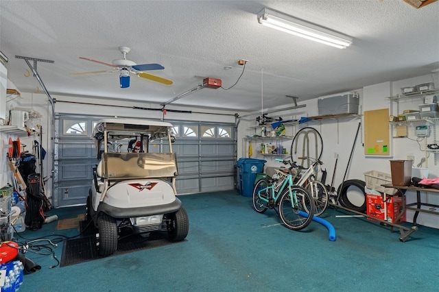 garage with a garage door opener and ceiling fan