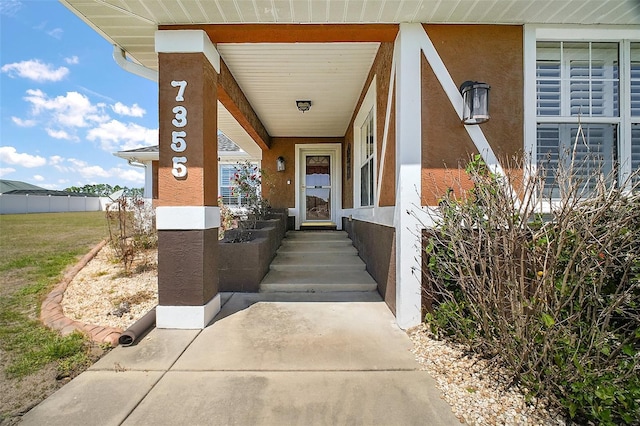 7355 SE 106th Pl, Belleview, FL 34420 - entrance to property featuring stucco siding and a porch
