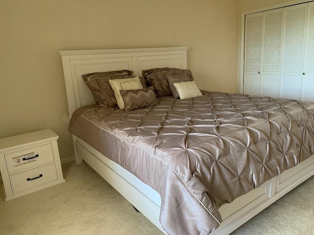 2600 Ocean Shore Blvd Unit 111, Ormond Beach, FL 32176 - bedroom featuring light colored carpet and a closet