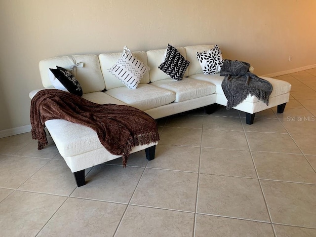 2600 Ocean Shore Blvd Unit 111, Ormond Beach, FL 32176 - living room featuring tile patterned floors and baseboards