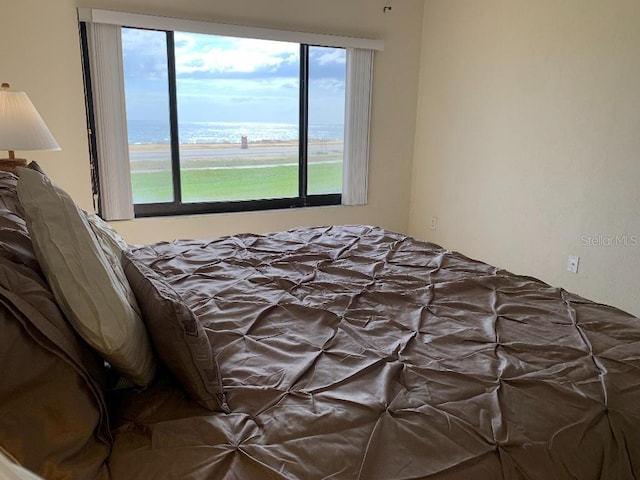 2600 Ocean Shore Blvd Unit 111, Ormond Beach, FL 32176 - bedroom with a water view