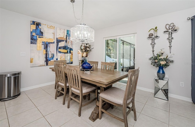 36419 Flats St, Zephyrhills, FL 33541 - dining space featuring a chandelier, light tile patterned floors, and baseboards