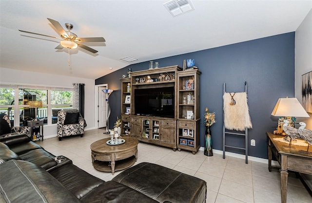 36419 Flats St, Zephyrhills, FL 33541 - living room with ceiling fan, light tile patterned floors, vaulted ceiling, and baseboards
