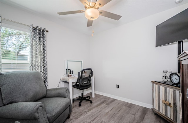 36419 Flats St, Zephyrhills, FL 33541 - home office featuring wood finished floors, a ceiling fan, and baseboards