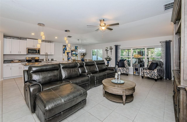 36419 Flats St, Zephyrhills, FL 33541 - living area with a ceiling fan, light tile patterned floors, and recessed lighting