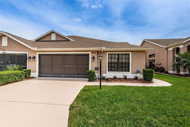 9636 Brookdale Dr, New Port Richey, FL 34655 - ranch-style house with a garage, a front yard, driveway, and stucco siding