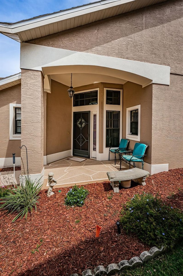 9636 Brookdale Dr, New Port Richey, FL 34655 - view of exterior entry with stucco siding