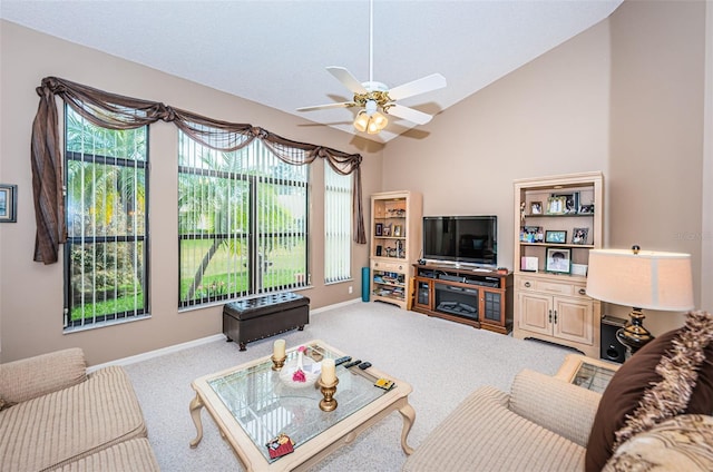 9636 Brookdale Dr, New Port Richey, FL 34655 - carpeted living area featuring baseboards, lofted ceiling, and a ceiling fan