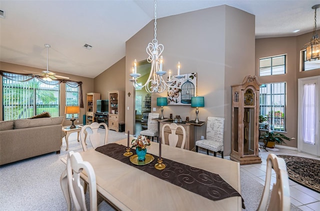 9636 Brookdale Dr, New Port Richey, FL 34655 - tiled dining space with ceiling fan with notable chandelier, visible vents, high vaulted ceiling, and baseboards
