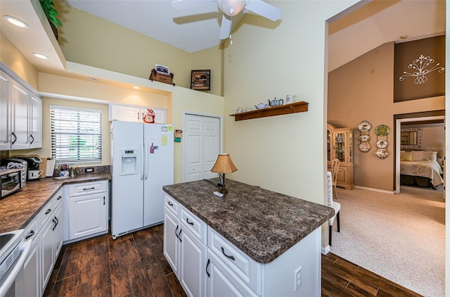 9636 Brookdale Dr, New Port Richey, FL 34655 - kitchen featuring white cabinets, white appliances, a ceiling fan, dark wood finished floors, and a center island