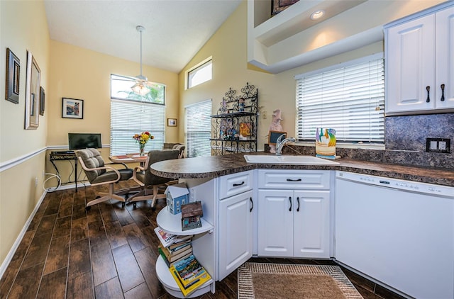 9636 Brookdale Dr, New Port Richey, FL 34655 - kitchen featuring white cabinetry, a sink, dark countertops, and dishwasher